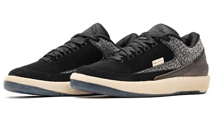 View of black and grey Air Jordan sneakers.